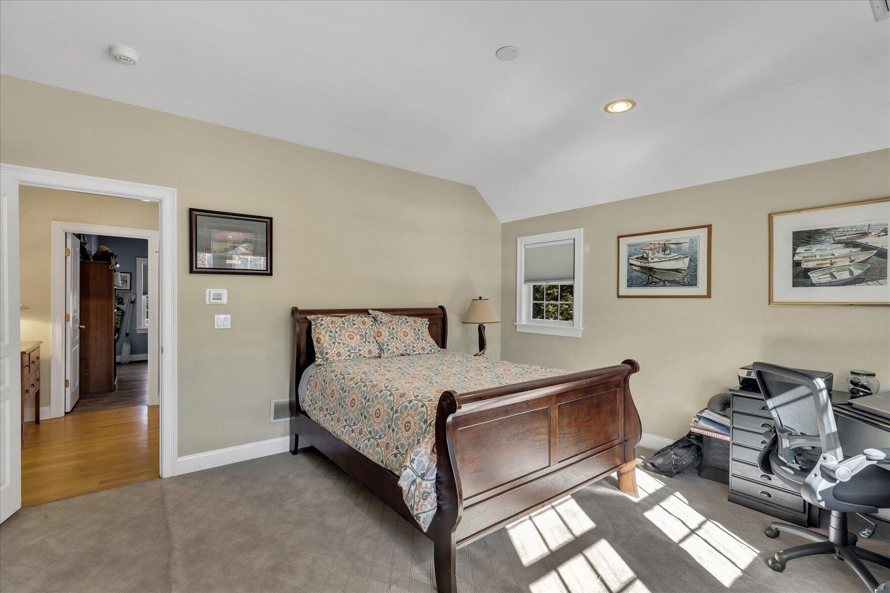 77 The Heights Mashpee, MA 02649 - Photo 33 of 52 a bedroom with a bed and wooden floor