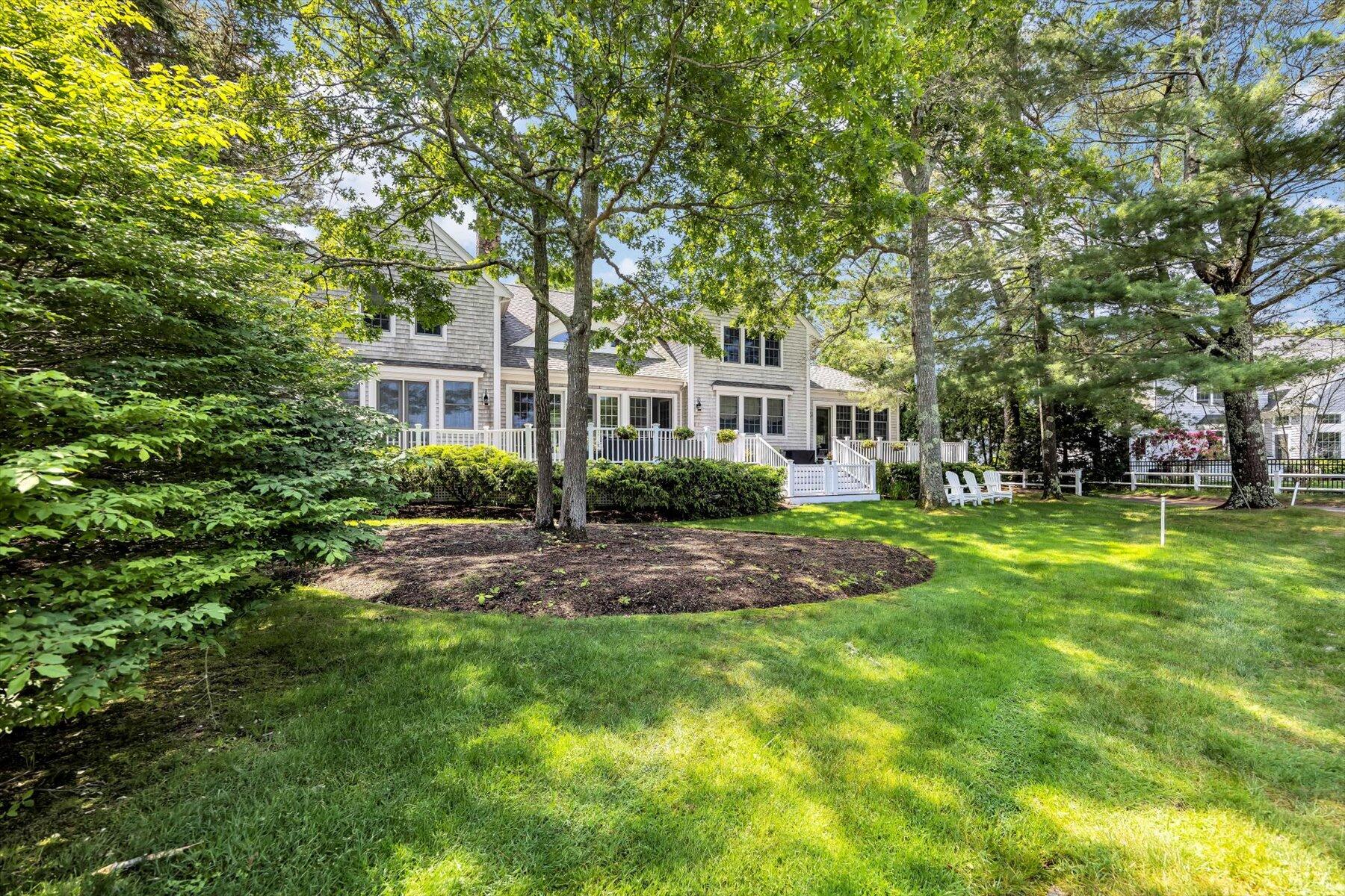 77 The Heights Mashpee, MA 02649 - Photo 36 of 52 a front view of a house with a yard