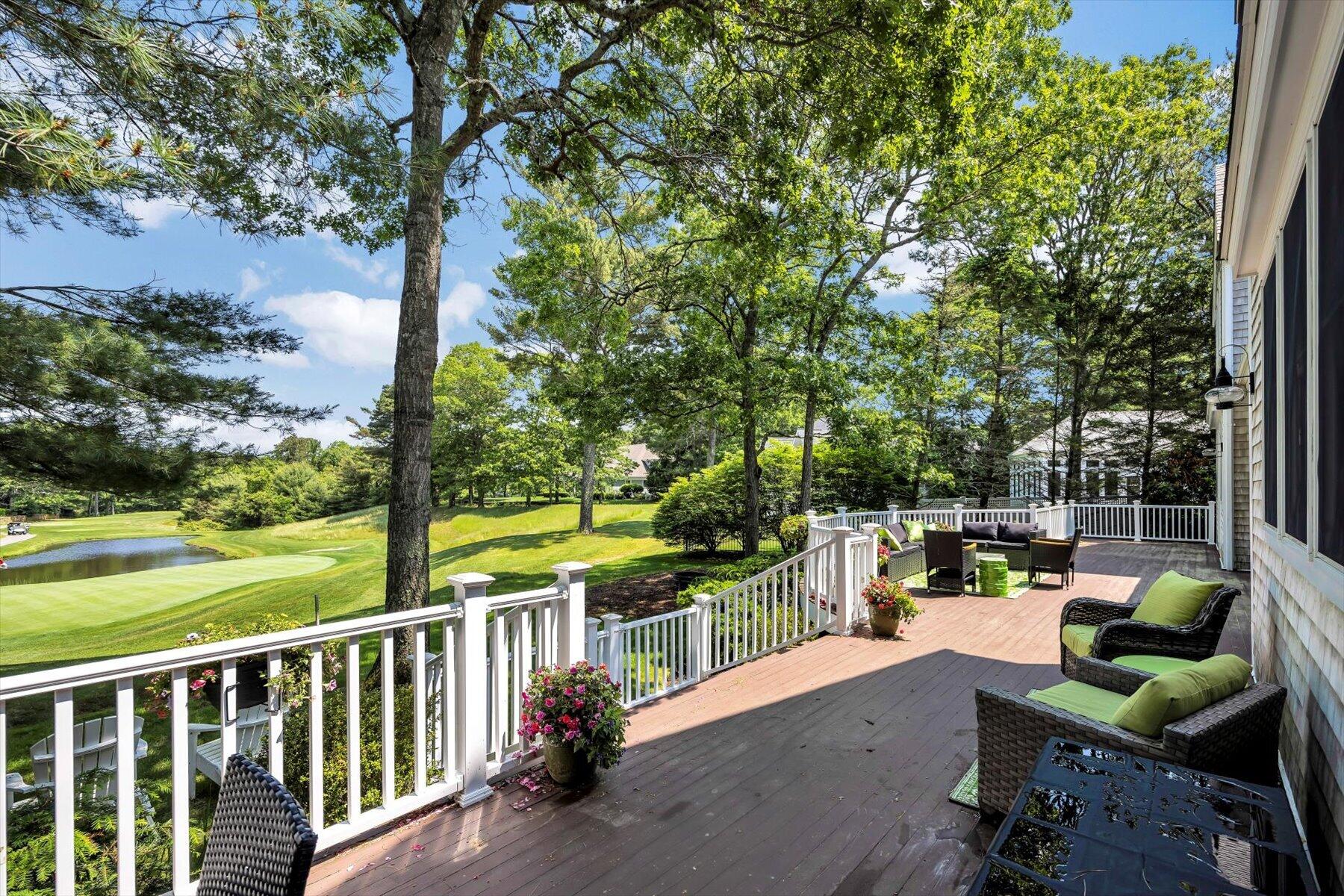 77 The Heights Mashpee, MA 02649 - Photo 38 of 52 a view of a chair and tables in the balcony
