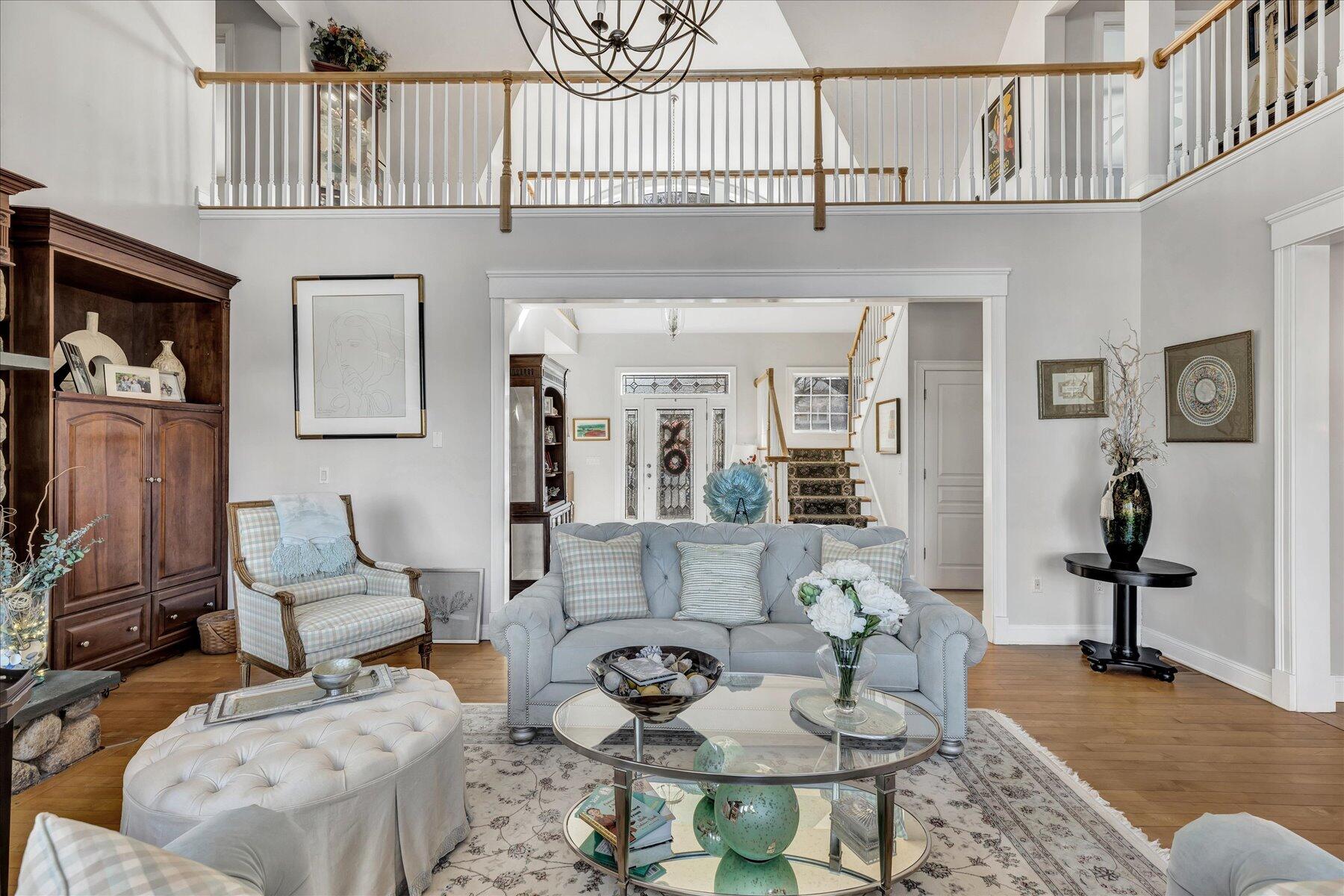 77 The Heights Mashpee, MA 02649 - Photo 9 of 52 a living room with furniture a rug and a flat screen tv