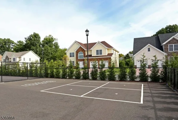 a view of a brick house with a yard