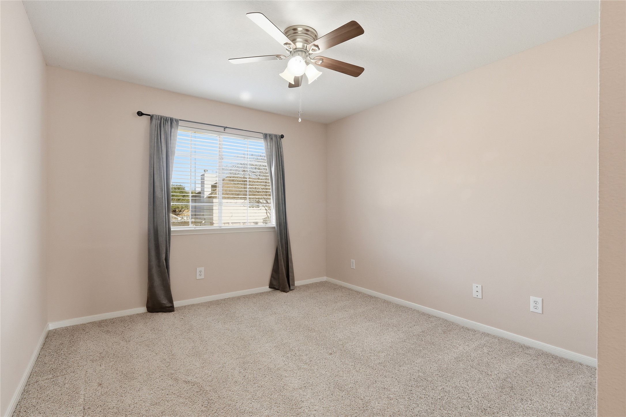 503 Elm Ridge Drive Spring, TX 77386 - Photo 17 of 21 an empty room with windows and fan