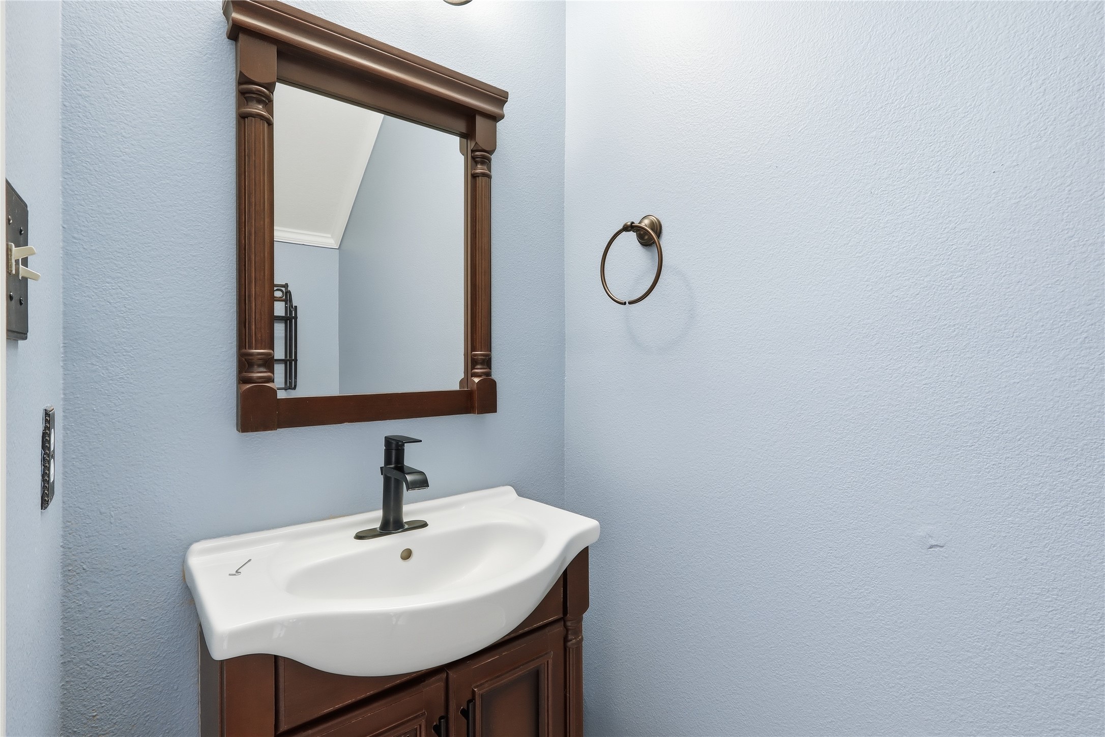 503 Elm Ridge Drive Spring, TX 77386 - Photo 10 of 21 a bathroom with a sink a mirror and a vanity