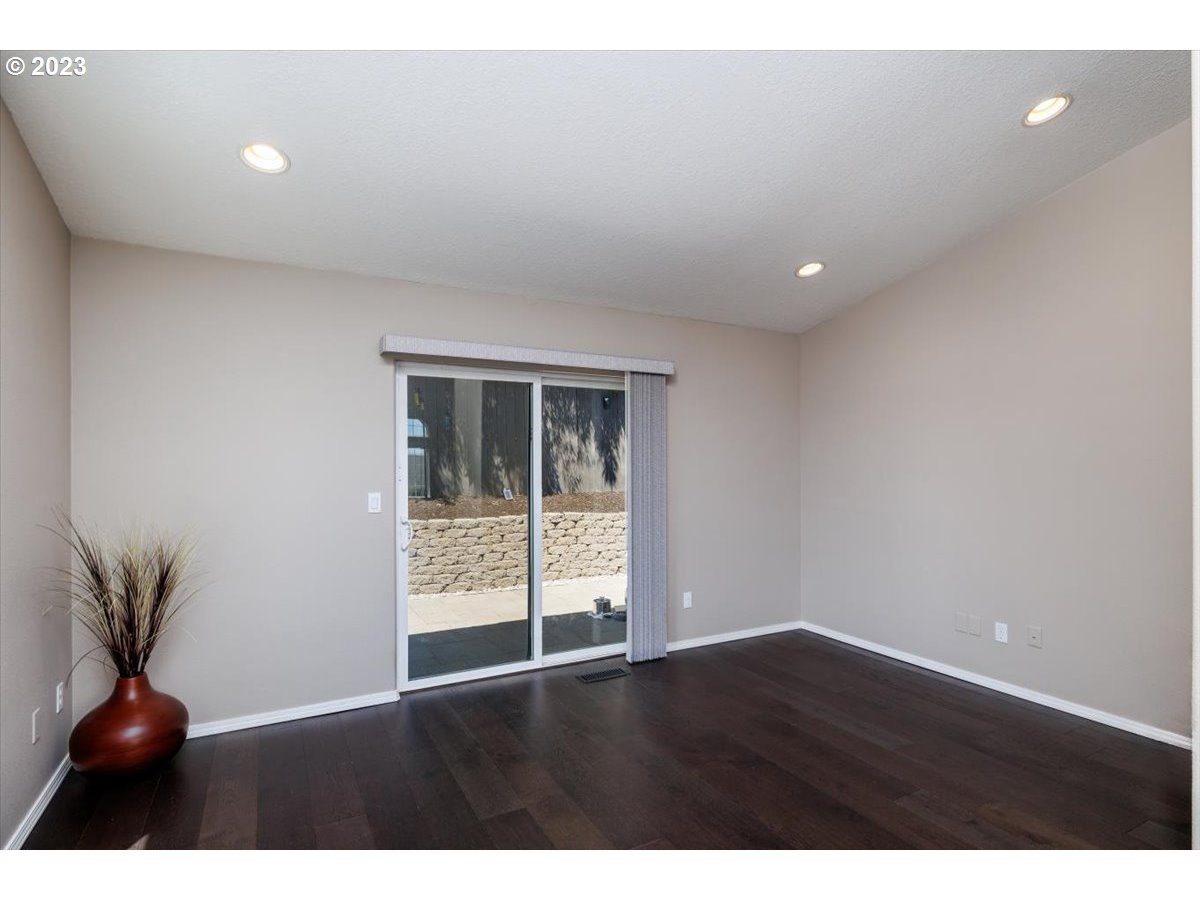 15855 Southwest Colyer Way Portland, OR 97224 - Photo 17 of 37 a view of an empty room with wooden floor