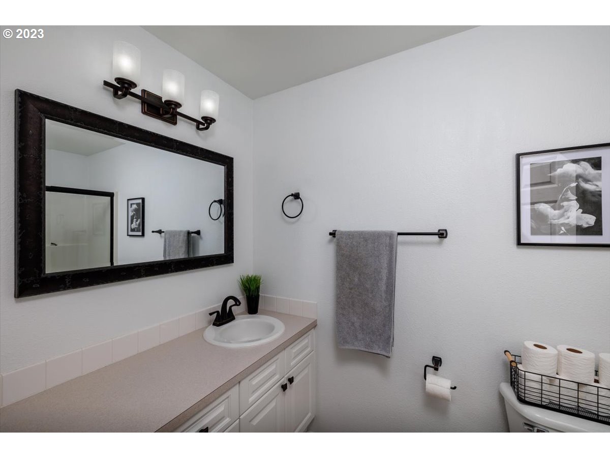 15855 Southwest Colyer Way Portland, OR 97224 - Photo 21 of 37 a bathroom with a sink a mirror and a shower