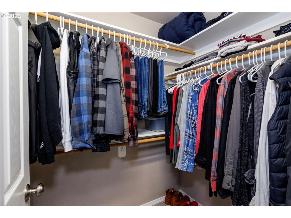 15855 Southwest Colyer Way Portland, OR 97224 - Photo 22 of 37 a view of walk in closet with clothes