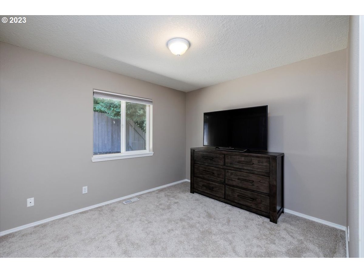 15855 Southwest Colyer Way Portland, OR 97224 - Photo 23 of 37 a living room with flat screen tv