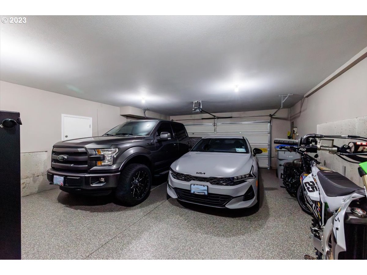 15855 Southwest Colyer Way Portland, OR 97224 - Photo 28 of 37 a car parked in a garage