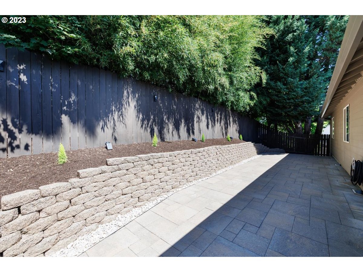 15855 Southwest Colyer Way Portland, OR 97224 - Photo 31 of 37 a backyard of a house with lots of green space