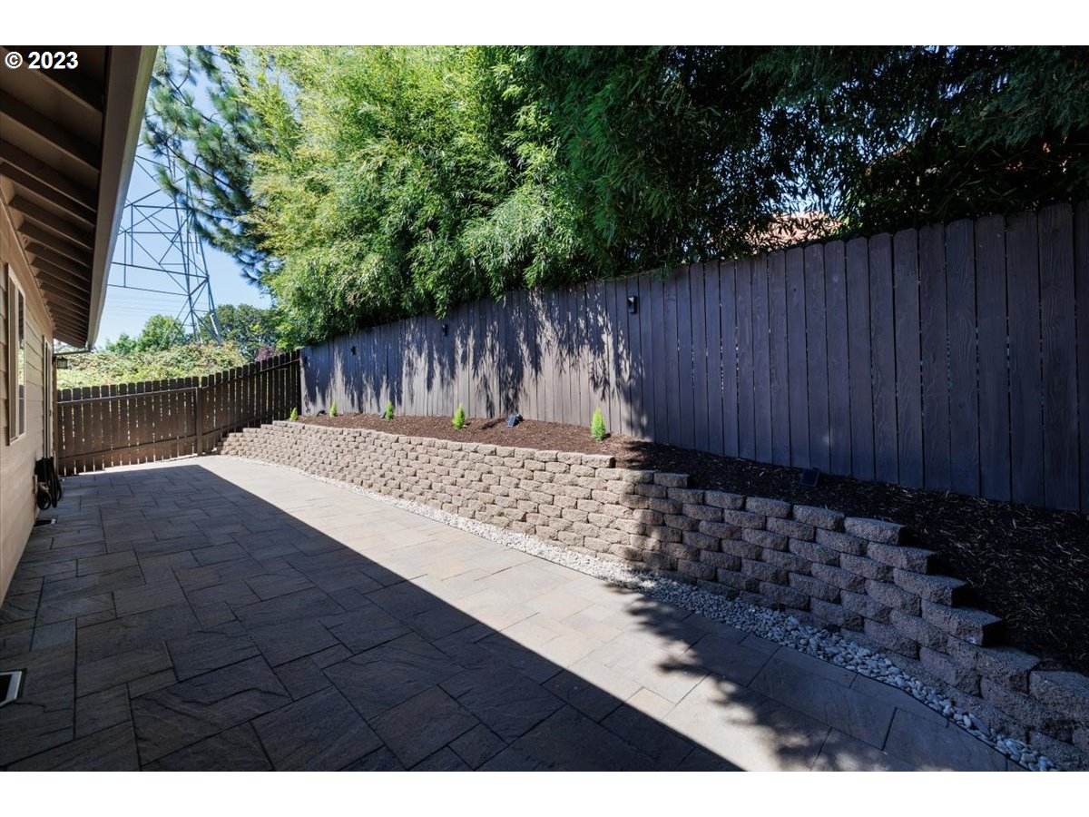 15855 Southwest Colyer Way Portland, OR 97224 - Photo 32 of 37 a view of a backyard with a wooden fence