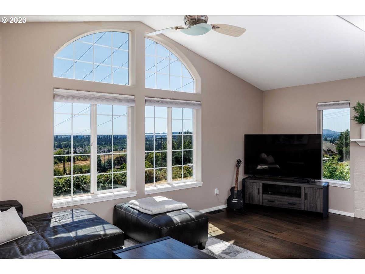 15855 Southwest Colyer Way Portland, OR 97224 - Photo 8 of 37 a living room with furniture and a flat screen tv