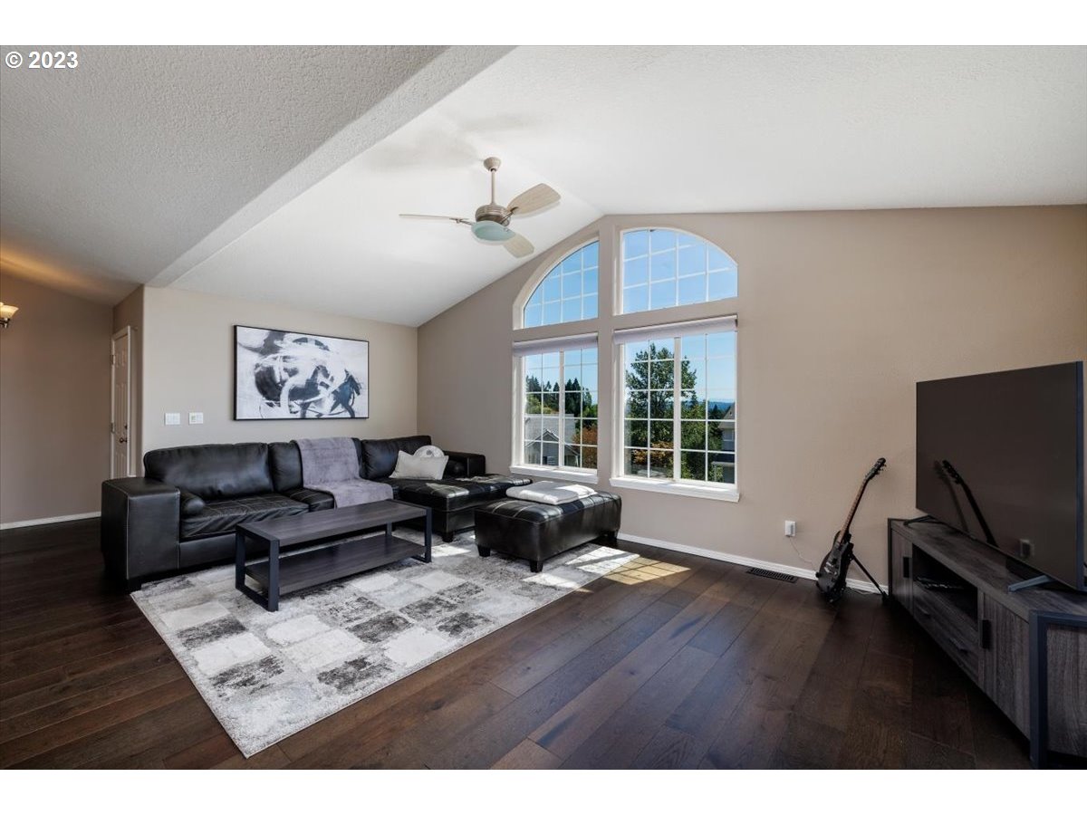 15855 Southwest Colyer Way Portland, OR 97224 - Photo 9 of 37 a living room with furniture a window and a flat screen tv