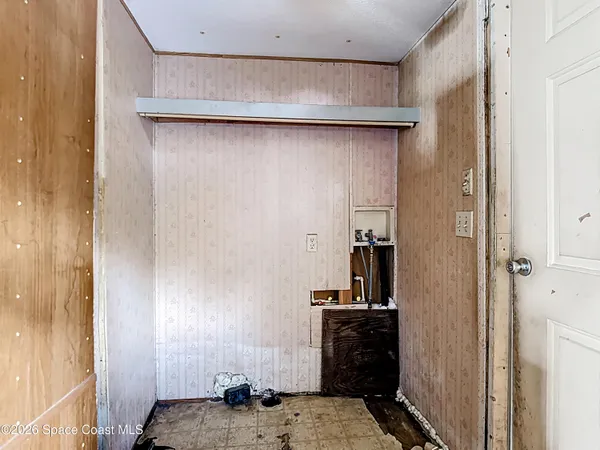 a view of a patio with table and chairs potted plants