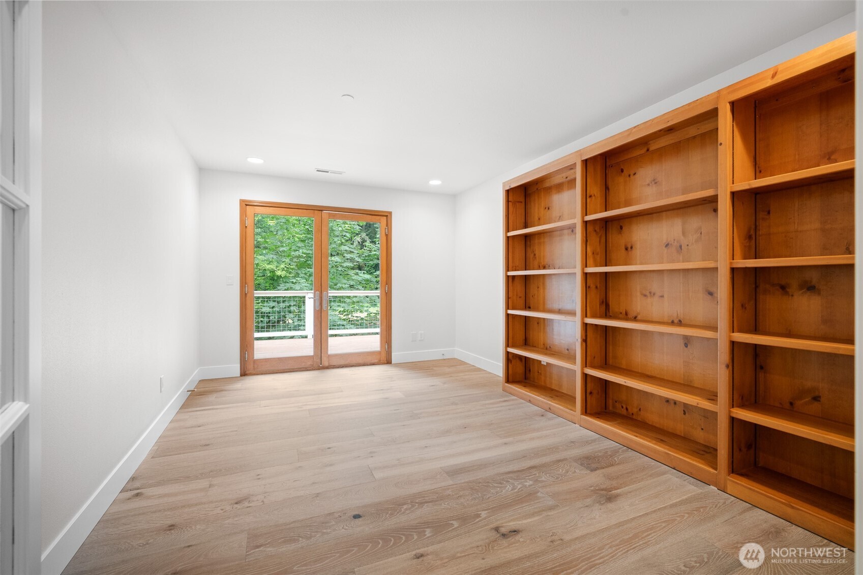 5656 Doran Road Acme, WA 98220 - Photo 27 of 39 a view of an empty room with wooden floor and a window