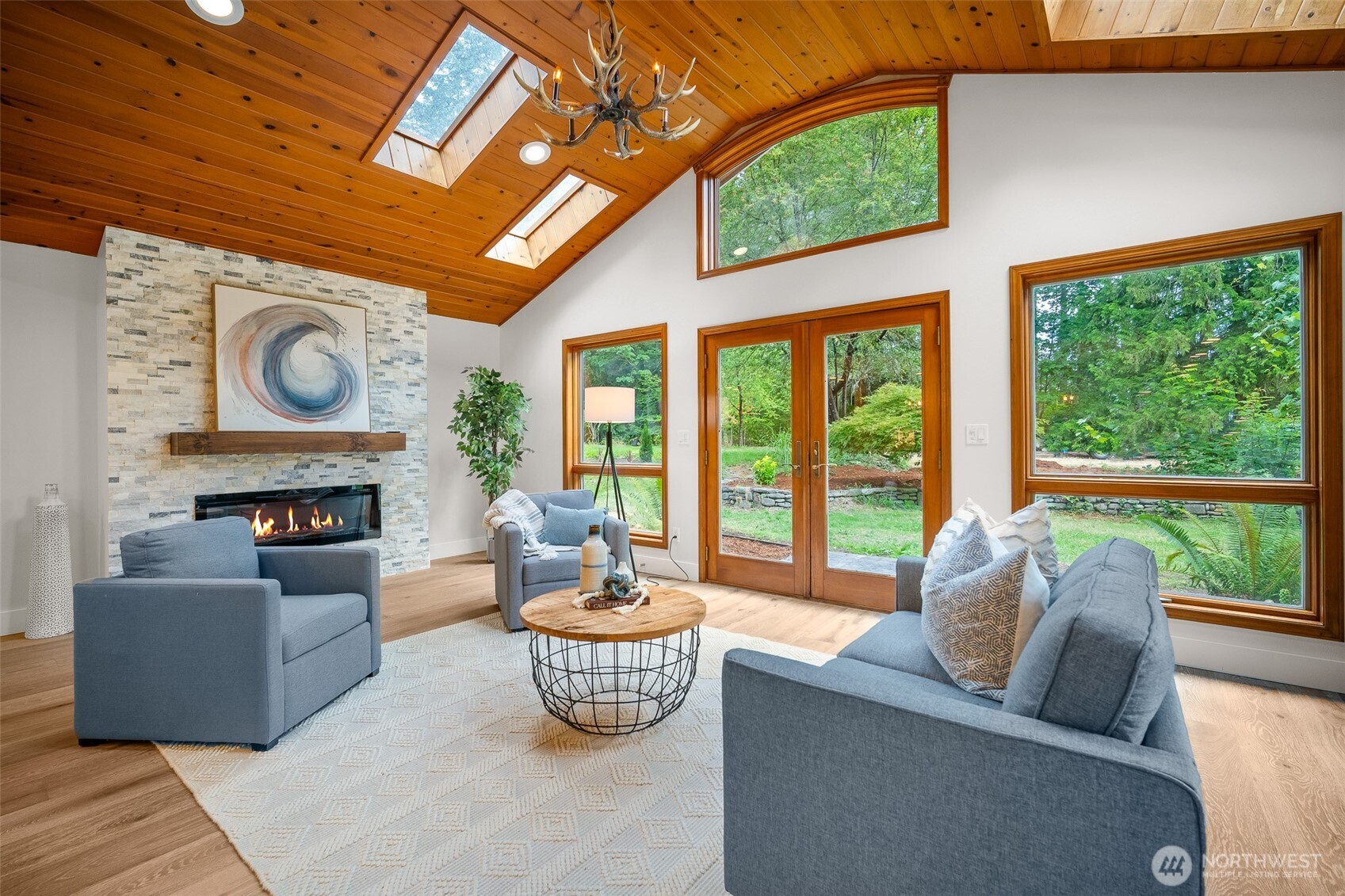 5656 Doran Road Acme, WA 98220 - Photo 10 of 39 a living room with furniture a fireplace and a large window