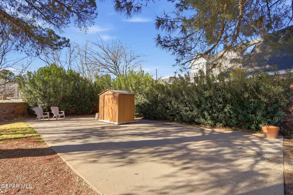 a house with a trees in front of it