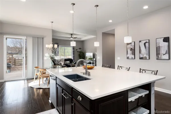a kitchen with a dining table and chairs