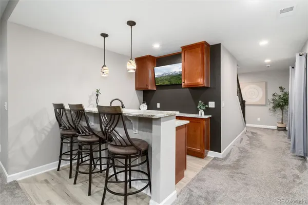 a view of a kitchen with a table and chairs