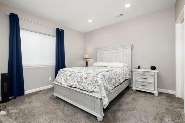 a bedroom with a bed and a cabinets