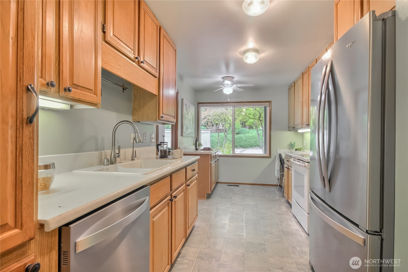 4106 221st Place Southeast, Unit 1072 Issaquah, WA 98029 - Photo 12 of 40 a kitchen with sink a refrigerator and window
