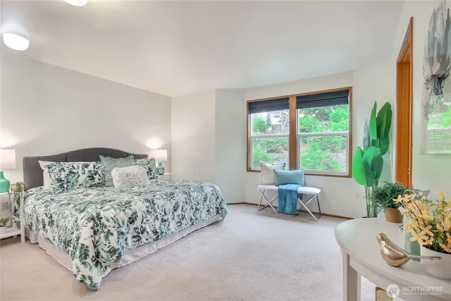 a bedroom with a large bed and a couch