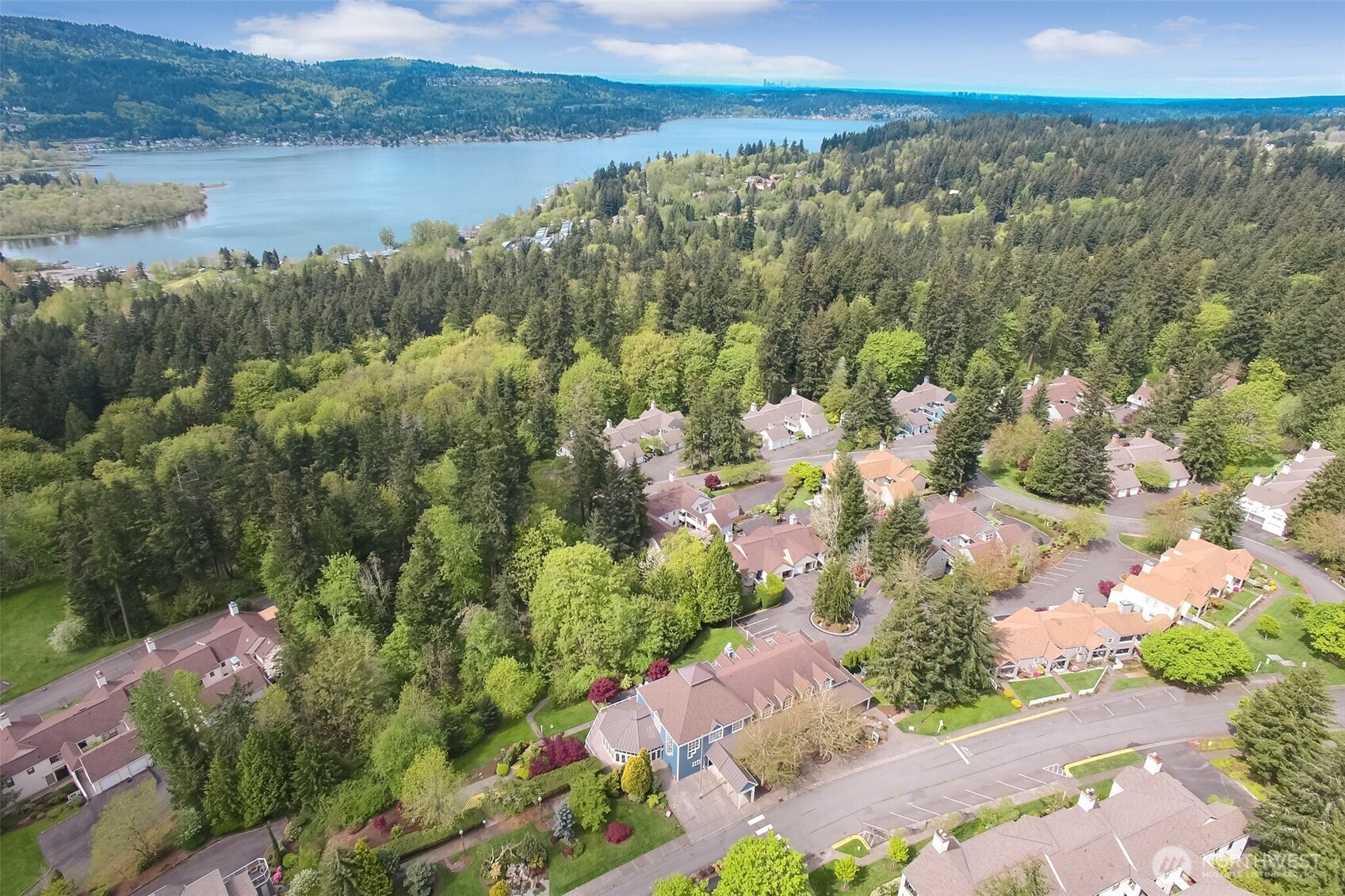 4106 221st Place Southeast, Unit 1072 Issaquah, WA 98029 - Photo 27 of 40 a view of a lake with a yard and mountain view