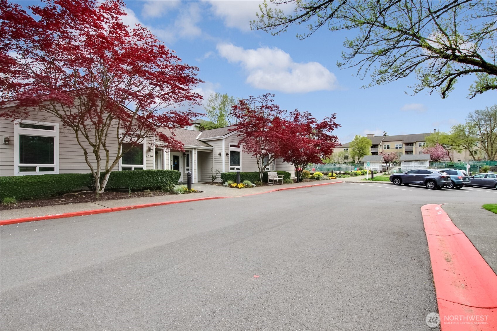 4106 221st Place Southeast, Unit 1072 Issaquah, WA 98029 - Photo 39 of 40 a street view with a building and trees around
