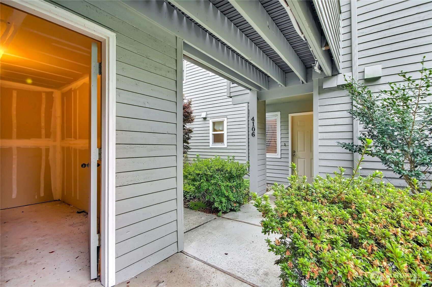 4106 221st Place Southeast, Unit 1072 Issaquah, WA 98029 - Photo 5 of 40 a view of a house with potted plants