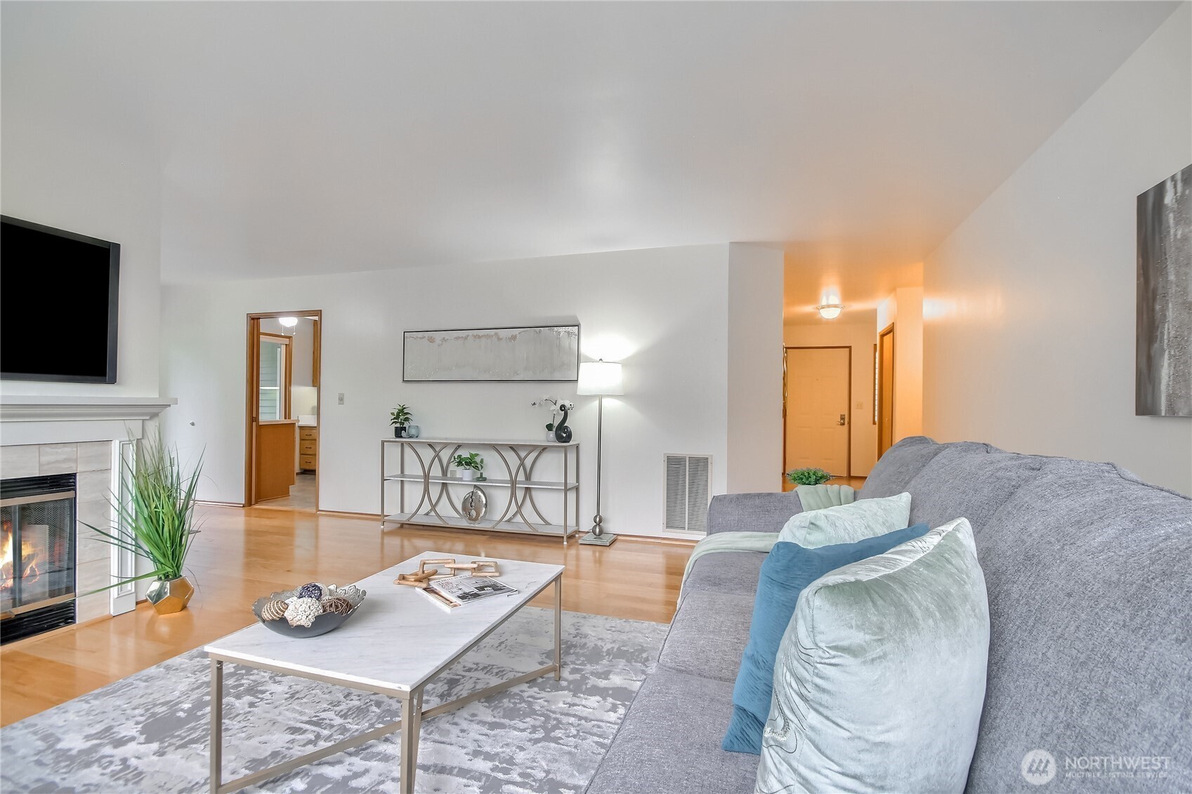 4106 221st Place Southeast, Unit 1072 Issaquah, WA 98029 - Photo 9 of 40 a living room with furniture and a fireplace
