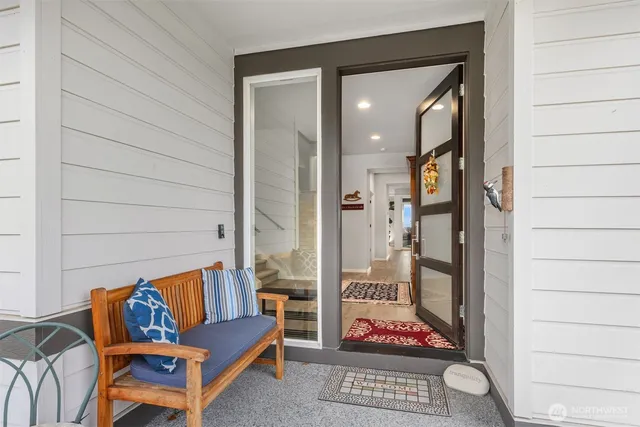 a living room with furniture and a rug