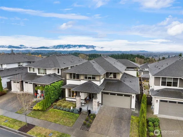 an aerial view of a residential apartment building with a yard