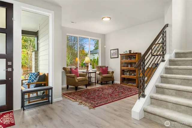 a living room with furniture and a rug