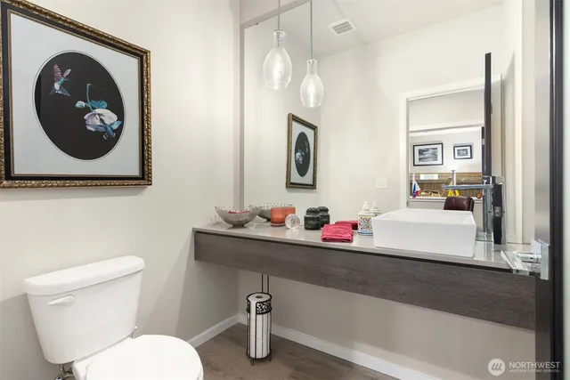 a bathroom with a toilet and a sink