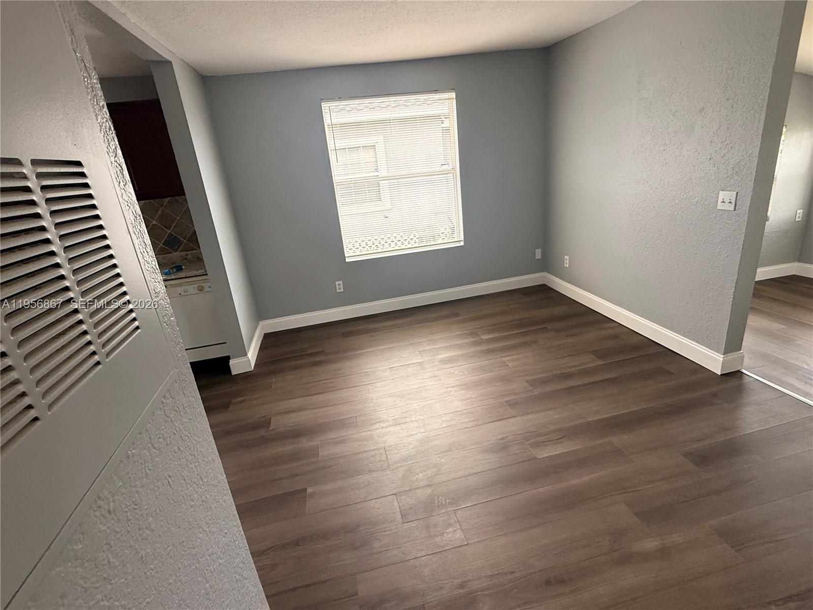 770 Broone Clermont, FL 34711 - Photo 14 of 32 an empty room with wooden floor and windows