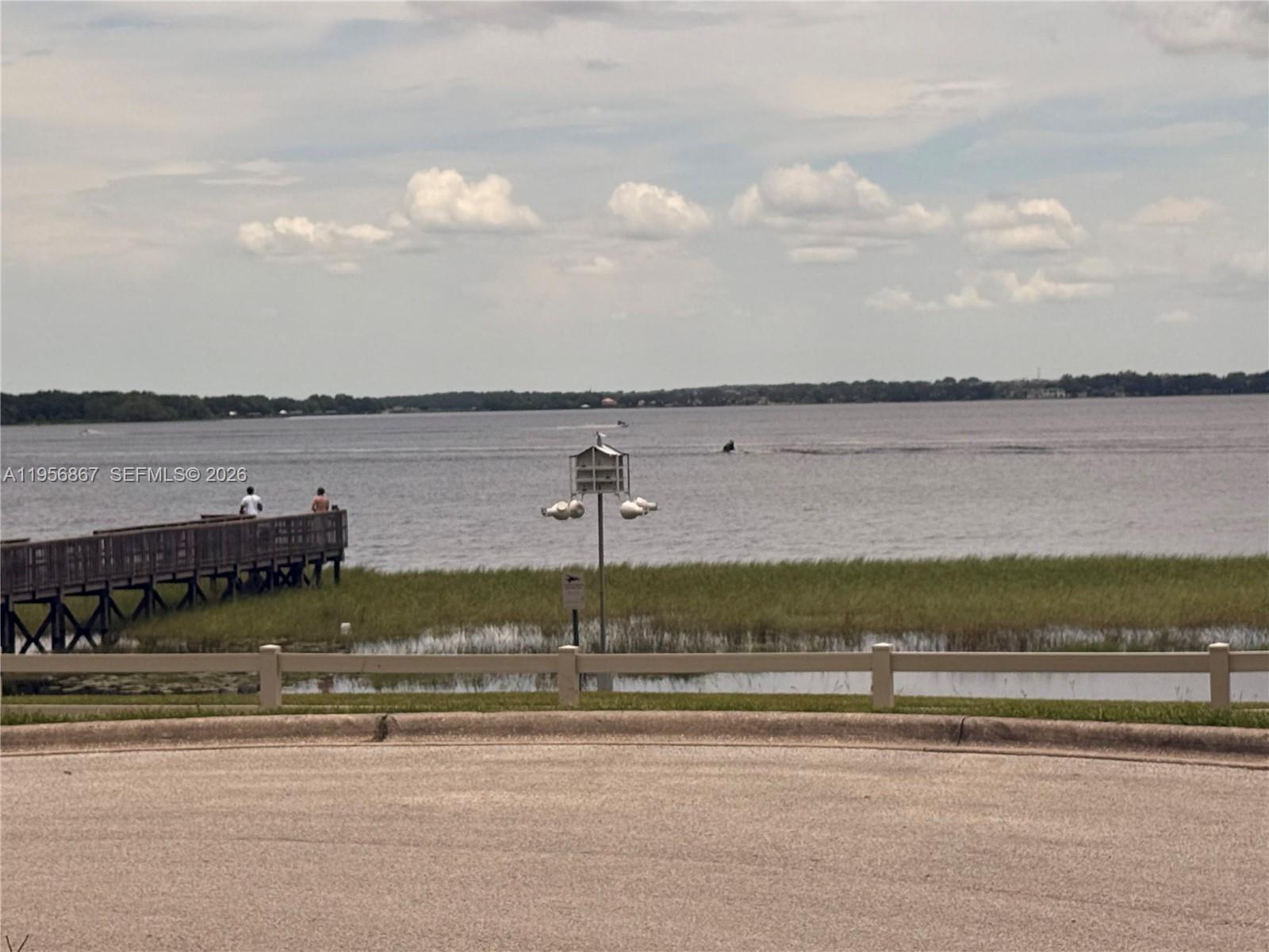 770 Broone Clermont, FL 34711 - Photo 32 of 32 a view of a lake with houses in the background