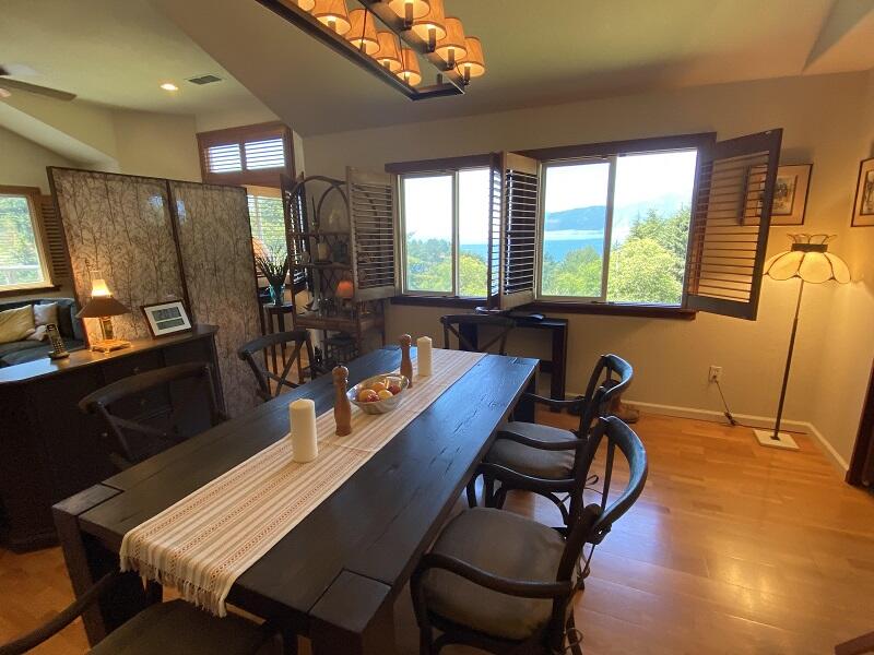 1050 Spring Road Shelter Cove, CA 95589 - Photo 5 of 42 a view of a dining room with furniture window and outside view