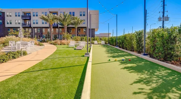 swimming pool view with a outdoor seating