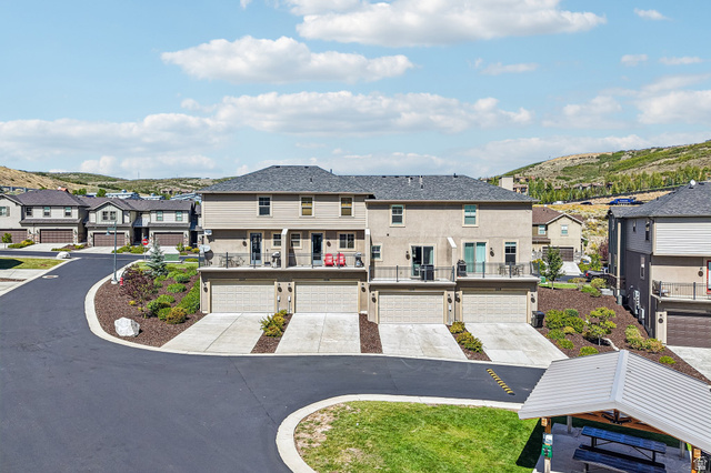 1107 West Wasatch Springs Road, Unit M3 Heber City, UT 84036 - Photo 32 of 34 Contemporary townhomes featuring attached garages, private balconies, and sloped rooflines