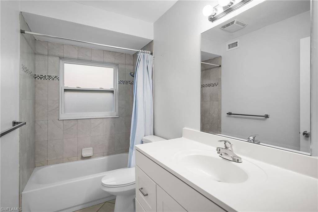 3581 Corana Way Naples, FL 34105 - Photo 15 of 26 a bathroom with a sink toilet and shower