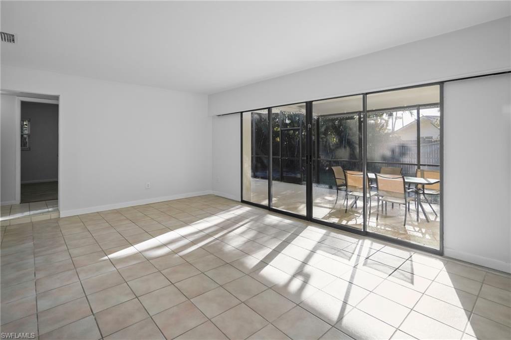 3581 Corana Way Naples, FL 34105 - Photo 3 of 26 a view of an empty room and window