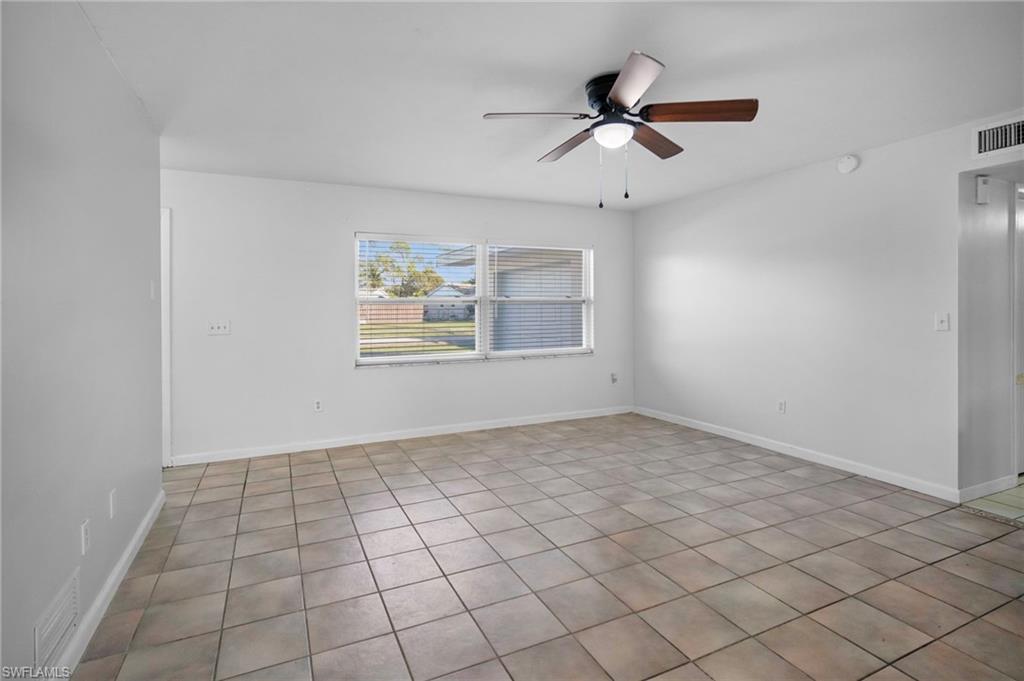 3581 Corana Way Naples, FL 34105 - Photo 5 of 26 a view of an empty room and window