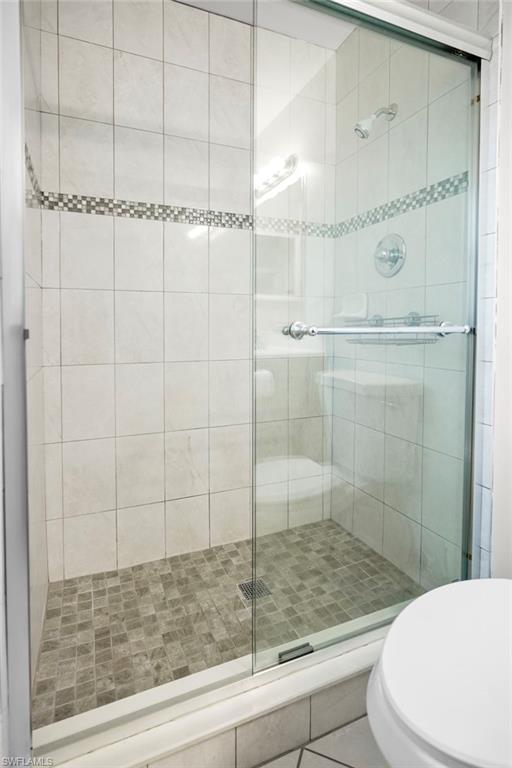 3581 Corana Way Naples, FL 34105 - Photo 9 of 26 a bathroom with a shower