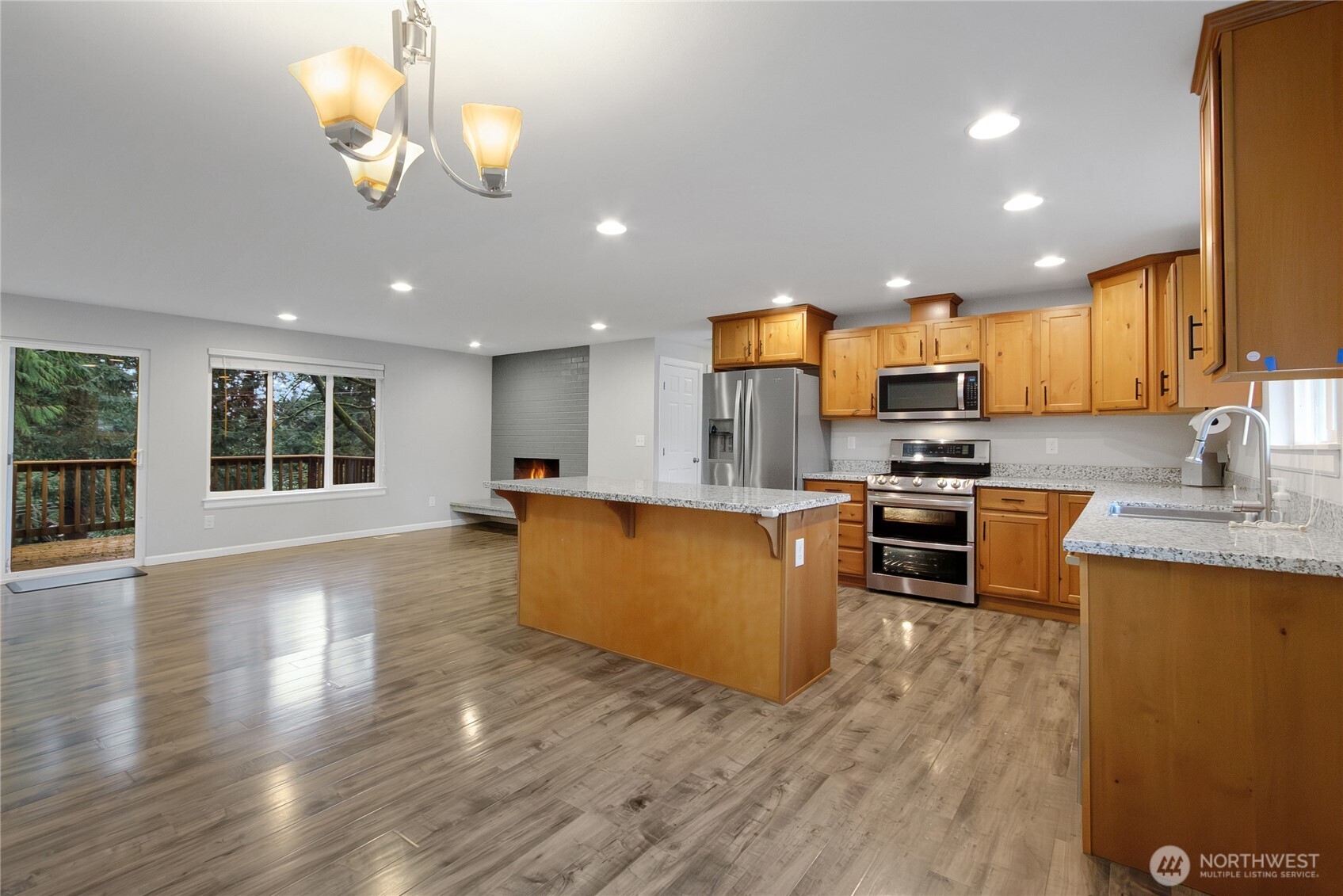 30331 9th Avenue South Federal Way, WA 98003 - Photo 13 of 36 a kitchen with stainless steel appliances granite countertop a refrigerator stove top oven and cabinets