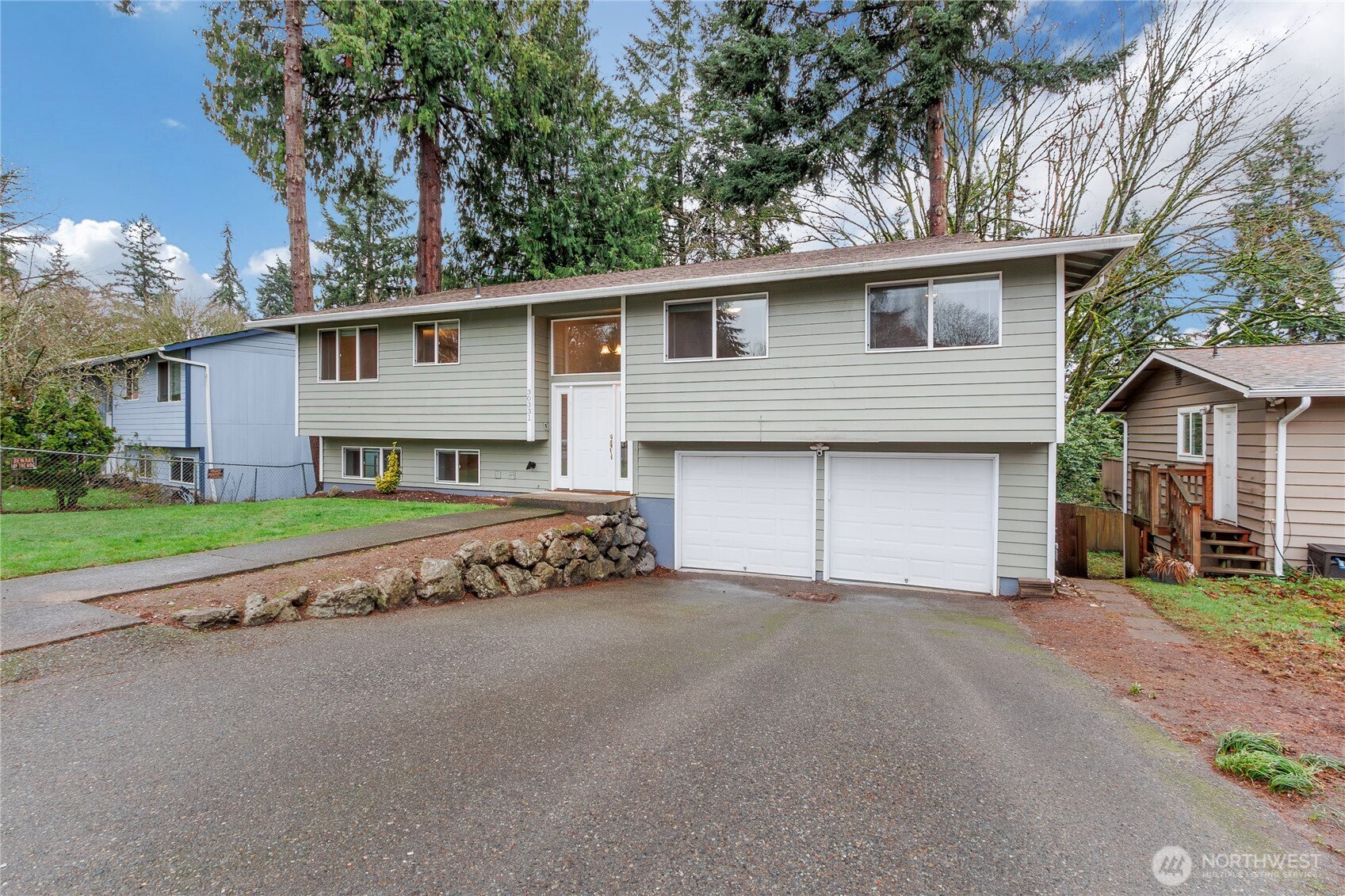 30331 9th Avenue South Federal Way, WA 98003 - Photo 2 of 36 a front view of a house with a yard and garage