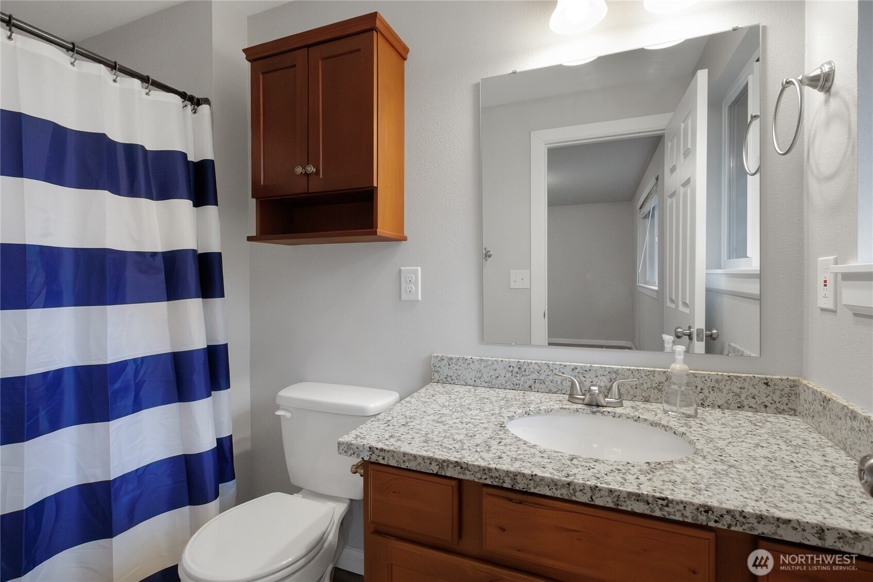 30331 9th Avenue South Federal Way, WA 98003 - Photo 21 of 36 a bathroom with a sink and a mirror