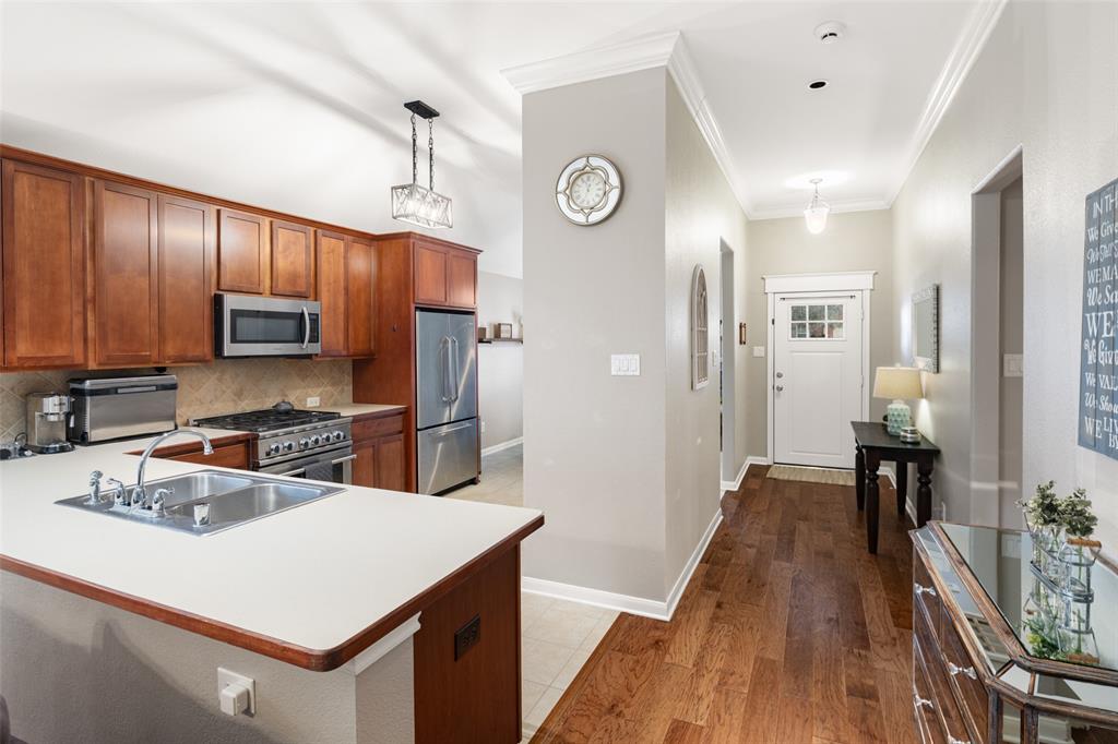7604 Uvalde Way McKinney, TX 75071 - Photo 34 of 34 Kitchen features Stainless Appliances, Gas Range, Plenty of Storage, Pantry and Open Floorplan.