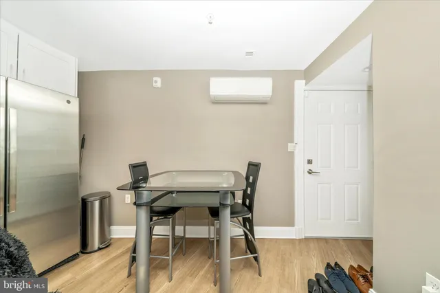a view of a room with a table and chairs