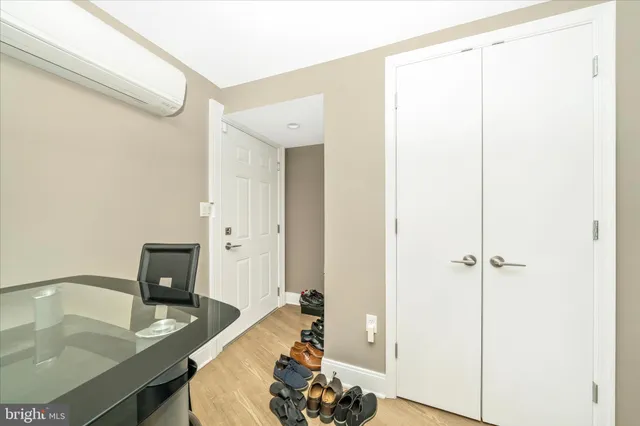 a view of a kitchen with dining area refrigerator and wooden floor
