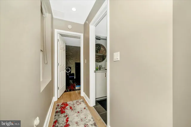 a bathroom with a sink mirror toilet and shower