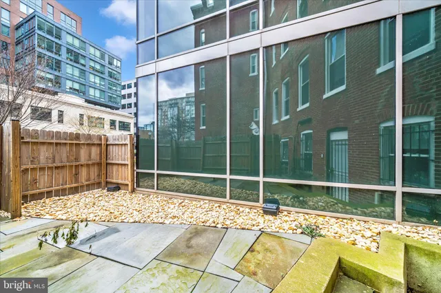a view of a brick building next to a yard